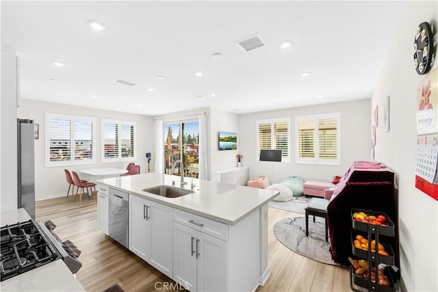1570 Topia Ave, Placentia, Placentia, CA 92870 - kitchen with a sink, appliances with stainless steel finishes, light wood finished floors, light countertops, and recessed lighting
