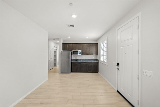 33168 Toledo Bend Ct, Winchester, CA 92596 - kitchen featuring stainless steel appliances, dark brown cabinetry, light wood-type flooring, and recessed lighting