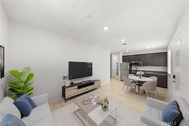 33168 Toledo Bend Ct, Winchester, CA 92596 - living area featuring recessed lighting and light wood-style flooring