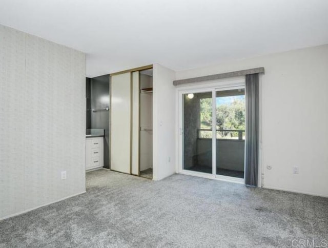 5366 Lake Murray Blvd, La Mesa, CA 91942 - unfurnished bedroom featuring access to exterior, light colored carpet, and a closet