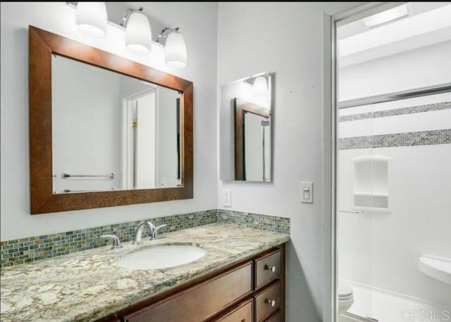 5366 Lake Murray Blvd, La Mesa, CA 91942 - bathroom featuring toilet, vanity, a shower, and backsplash