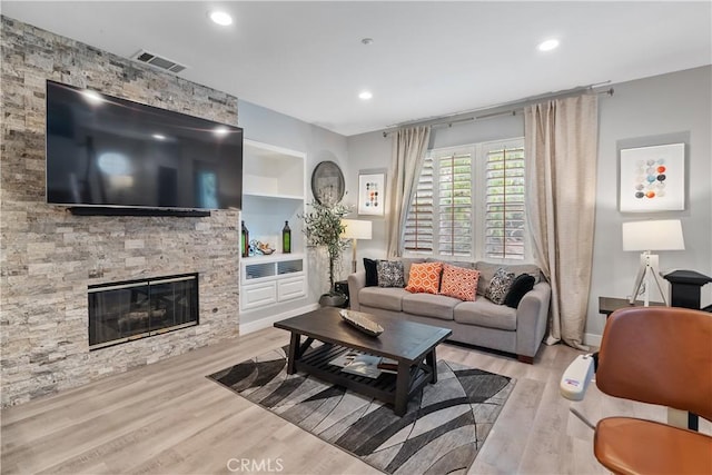 39 Windward Way, Buena Park, CA 90621 - living area with wood finished floors, a fireplace, recessed lighting, and built in features