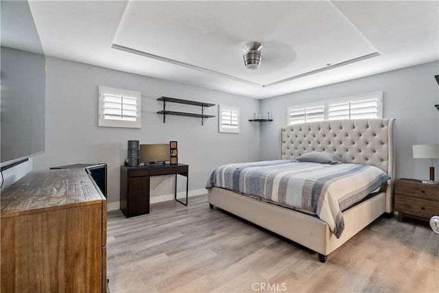 39 Windward Way, Buena Park, CA 90621 - bedroom with light wood-type flooring and a tray ceiling