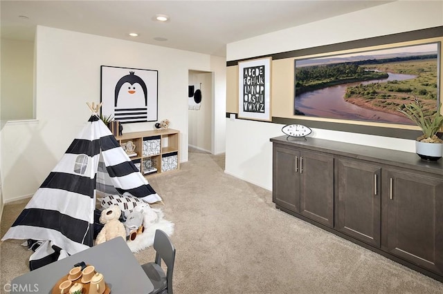 8504 Peachwillow Ct, Jurupa Valley, CA 92509 - living area featuring light carpet, baseboards, and recessed lighting