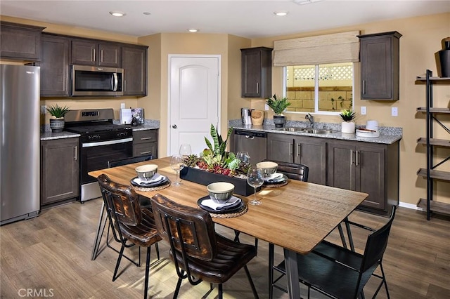 8504 Peachwillow Ct, Jurupa Valley, CA 92509 - dining space with wood finished floors and recessed lighting