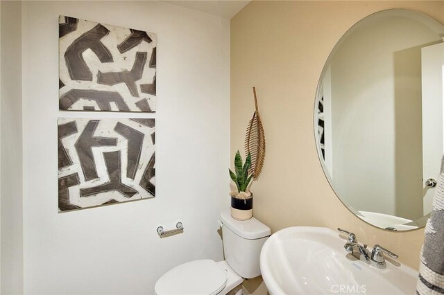 8504 Peachwillow Ct, Jurupa Valley, CA 92509 - half bathroom with a sink and toilet