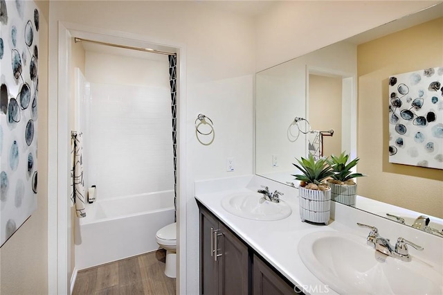 8504 Peachwillow Ct, Jurupa Valley, CA 92509 - full bath with toilet, wood finished floors, double vanity, and shower / tub combination