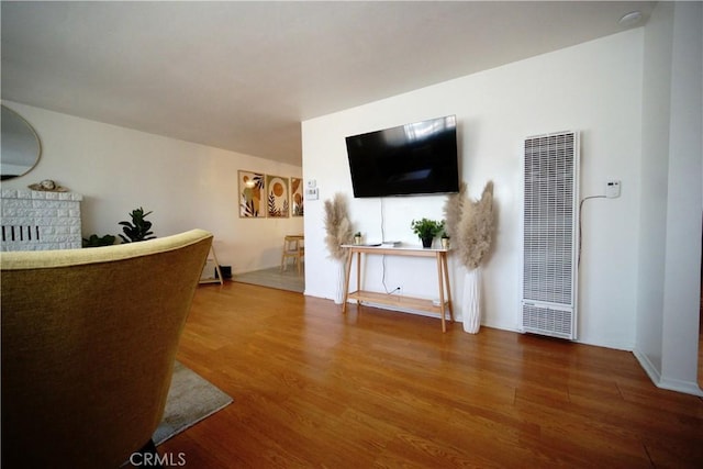 61740 Oleander Dr, Joshua Tree, CA 92252 - living area featuring a heating unit and wood finished floors