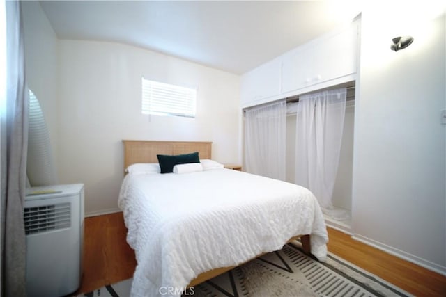 61740 Oleander Dr, Joshua Tree, CA 92252 - bedroom featuring wood finished floors and a closet