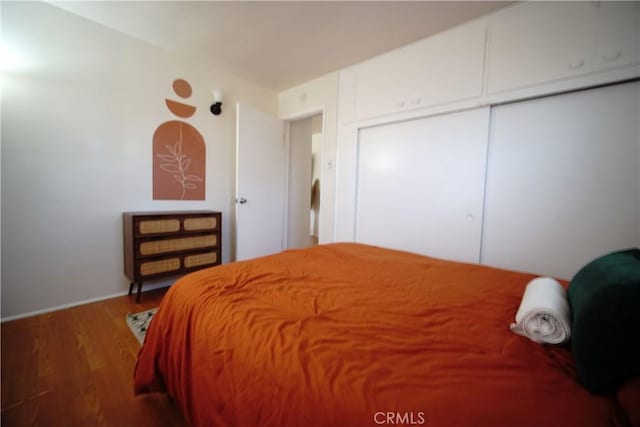 61740 Oleander Dr, Joshua Tree, CA 92252 - bedroom with wood finished floors and a closet