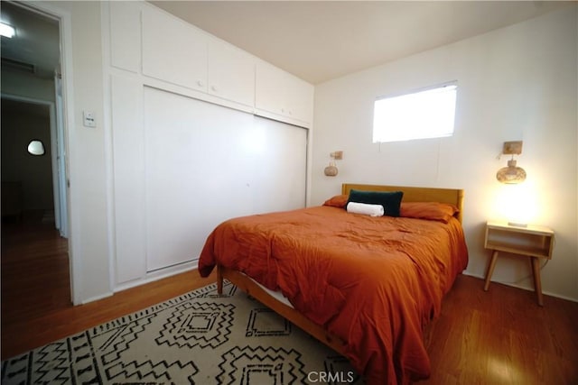 61740 Oleander Dr, Joshua Tree, CA 92252 - bedroom with wood finished floors and a closet