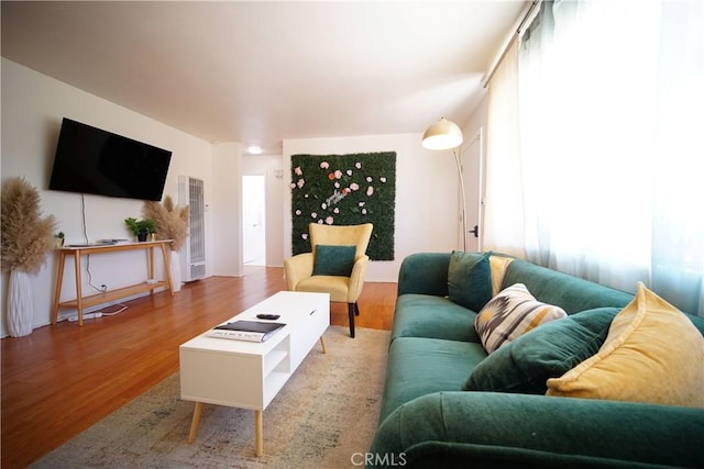61740 Oleander Dr, Joshua Tree, CA 92252 - living area featuring a heating unit and wood finished floors