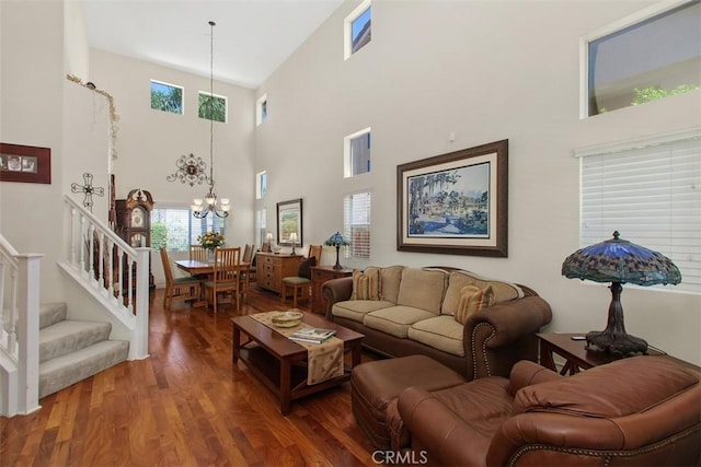 33370 Morning View Dr, Temecula, CA 92592 - living room featuring a high ceiling, wood finished floors, a chandelier, and stairs