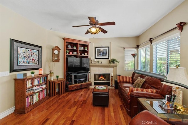 33370 Morning View Dr, Temecula, CA 92592 - living area with wood finished floors, a ceiling fan, and a fireplace