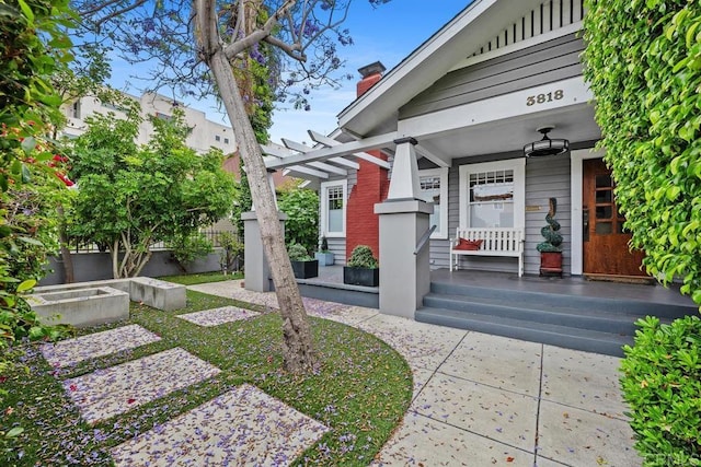 3818 Herbert St, San Diego, CA 92103 - doorway to property featuring covered porch and a chimney