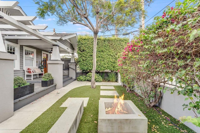 3818 Herbert St, San Diego, CA 92103 - view of yard with a fire pit, a porch, and a pergola
