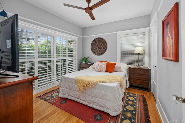 3818 Herbert St, San Diego, CA 92103 - bedroom featuring wood finished floors, baseboards, and a ceiling fan