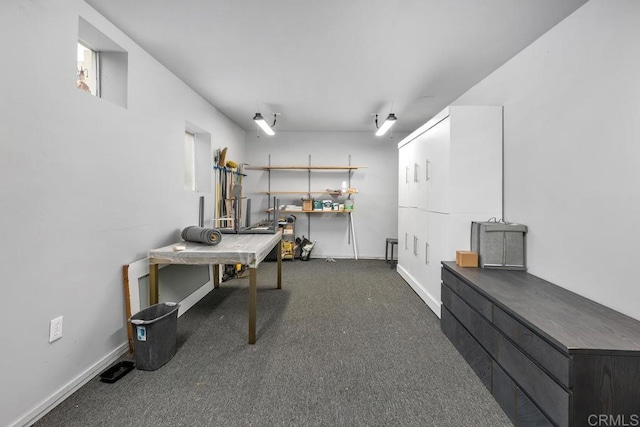 3818 Herbert St, San Diego, CA 92103 - home office with dark colored carpet, a workshop area, and baseboards