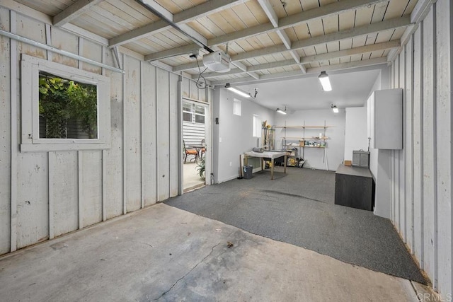 3818 Herbert St, San Diego, CA 92103 - garage with a garage door opener and a workshop area