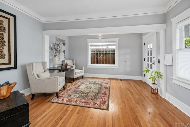 3818 Herbert St, San Diego, CA 92103 - sitting room with wood finished floors, baseboards, and crown molding