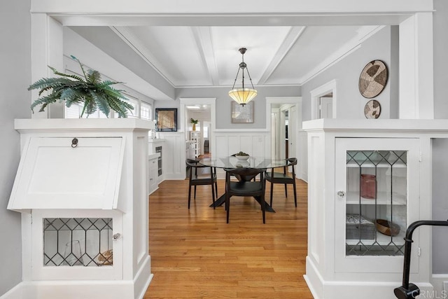 3818 Herbert St, San Diego, CA 92103 - dining area with beamed ceiling, light wood-style flooring, and ornamental molding