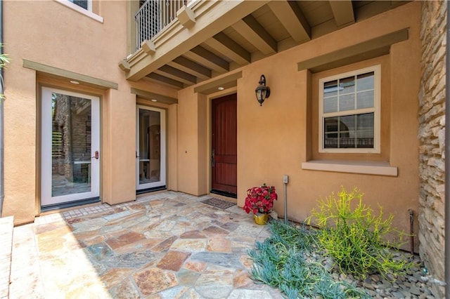 29 Shepard, Irvine, CA 92620 - entrance to property featuring a balcony, stucco siding, and a patio