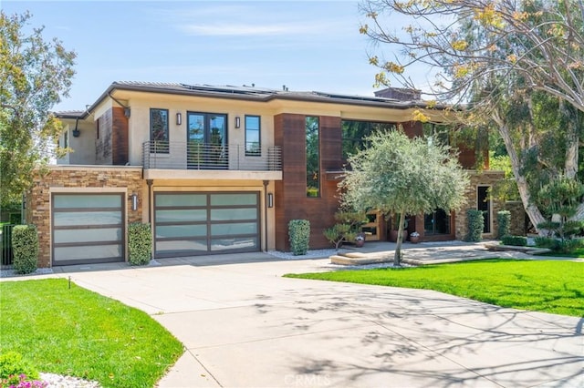 1410 Santa Margarita Dr, Arcadia, CA 91006 - view of front of property with a balcony, a garage, driveway, roof mounted solar panels, and a front yard