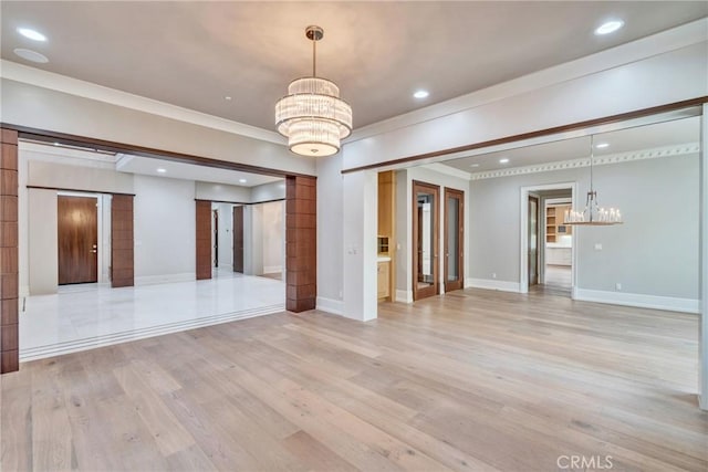 1410 Santa Margarita Dr, Arcadia, CA 91006 - unfurnished living room featuring a chandelier, light wood-style floors, ornamental molding, recessed lighting, and a barn door
