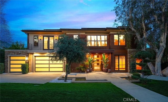 1410 Santa Margarita Dr, Arcadia, CA 91006 - back of property at dusk with roof mounted solar panels, french doors, a yard, driveway, and an attached garage