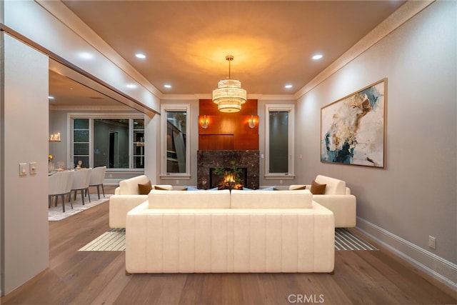 1410 Santa Margarita Dr, Arcadia, CA 91006 - living area featuring wood finished floors, a premium fireplace, a chandelier, crown molding, and recessed lighting