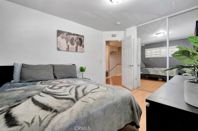 15414 Ficus St, Chino Hills, CA 91709 - bedroom featuring light wood finished floors and a closet