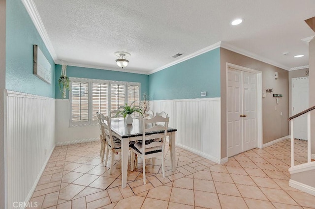 15414 Ficus St, Chino Hills, CA 91709 - dining area with wainscoting, crown molding, light tile patterned floors, recessed lighting, and a textured ceiling