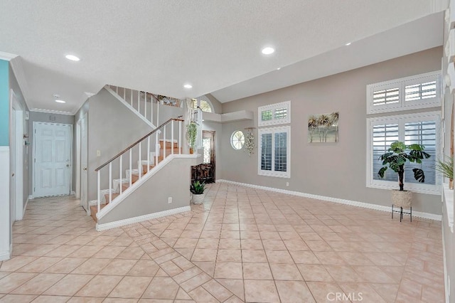 15414 Ficus St, Chino Hills, CA 91709 - foyer entrance featuring stairway, light tile patterned floors, recessed lighting, baseboards, and ornamental molding