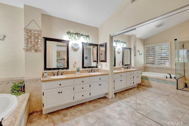 15414 Ficus St, Chino Hills, CA 91709 - bathroom featuring lofted ceiling, double vanity, a garden tub, and a tile shower
