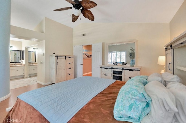 15414 Ficus St, Chino Hills, CA 91709 - bedroom with a barn door, a spacious closet, high vaulted ceiling, connected bathroom, and a ceiling fan