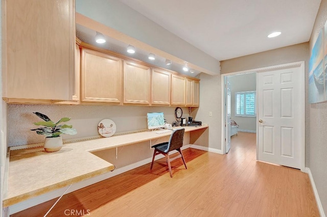 15414 Ficus St, Chino Hills, CA 91709 - office area featuring built in desk, light wood finished floors, baseboards, and recessed lighting