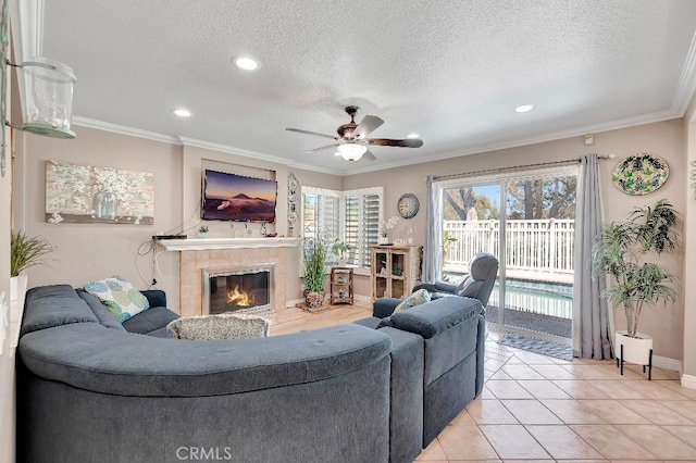 15414 Ficus St, Chino Hills, CA 91709 - living area with a ceiling fan, a textured ceiling, a tile fireplace, baseboards, and recessed lighting