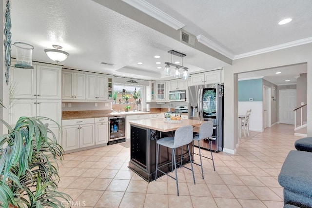 15414 Ficus St, Chino Hills, CA 91709 - kitchen with appliances with stainless steel finishes, wine cooler, light countertops, a kitchen bar, and light tile patterned floors