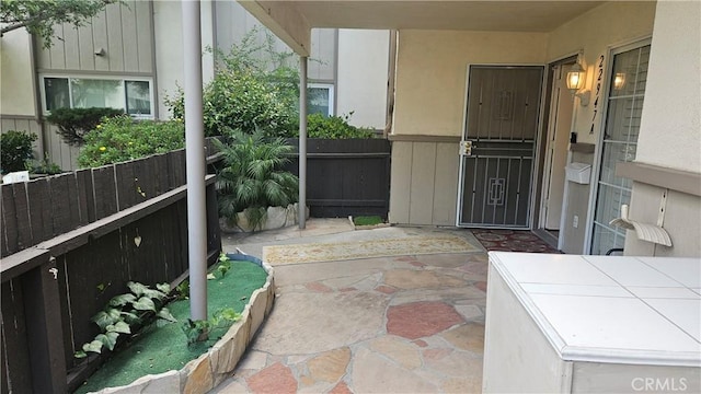 22947 Nadine Cir Unit A, Torrance, CA 90505 - view of exterior entry with a patio and stucco siding