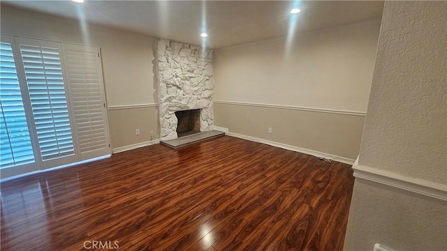 22947 Nadine Cir Unit A, Torrance, CA 90505 - unfurnished living room featuring wood finished floors and a stone fireplace