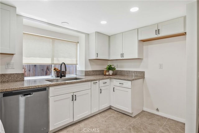 23326 Elfin Pl, Moreno Valley, CA 92557 - kitchen featuring stainless steel dishwasher, white cabinets, light tile patterned floors, light stone countertops, and recessed lighting