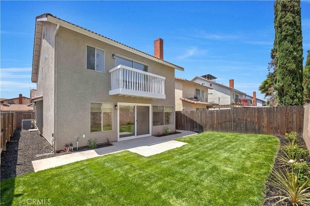 23326 Elfin Pl, Moreno Valley, CA 92557 - back of property featuring a balcony, a fenced backyard, stucco siding, a patio, and a chimney