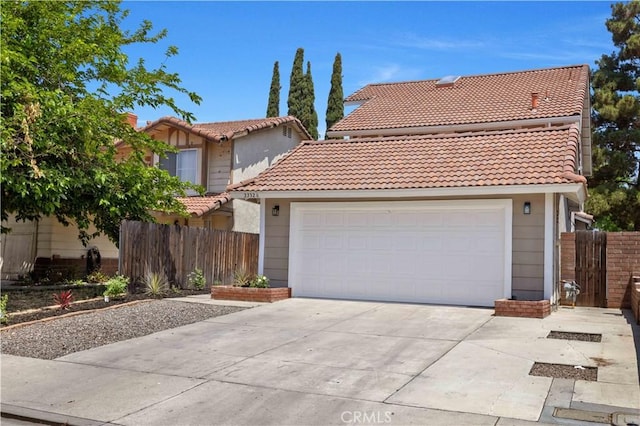 23326 Elfin Pl, Moreno Valley, CA 92557 - view of front of house featuring a tiled roof, concrete driveway, and an attached garage