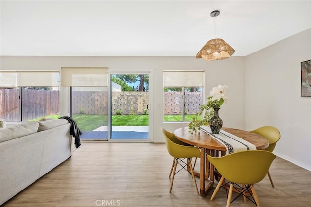 23326 Elfin Pl, Moreno Valley, CA 92557 - dining space with wood finished floors and baseboards