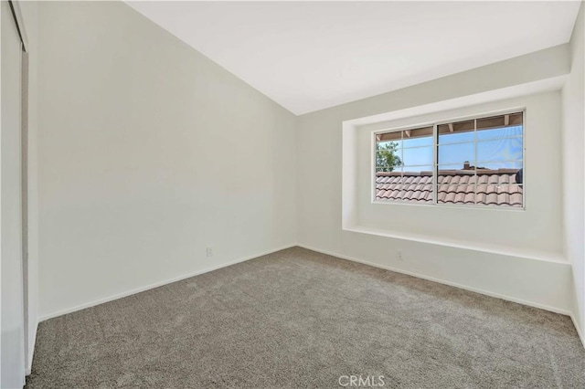 23326 Elfin Pl, Moreno Valley, CA 92557 - carpeted spare room with vaulted ceiling and baseboards