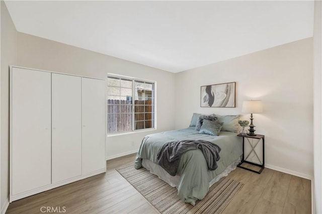 23326 Elfin Pl, Moreno Valley, CA 92557 - bedroom with light wood-style flooring and a closet