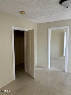 505 S Rowan Ave, Los Angeles, CA 90063 - unfurnished bedroom featuring a closet and a textured ceiling