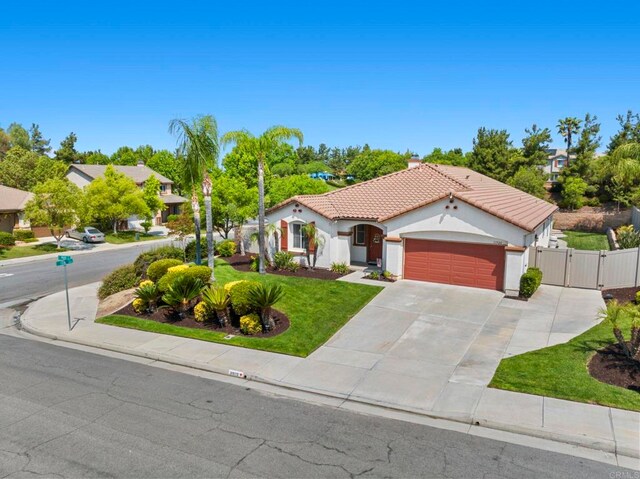 31920 Pasos Pl, Temecula, CA 92591 - mediterranean / spanish home with a gate, a garage, a tiled roof, driveway, and stucco siding