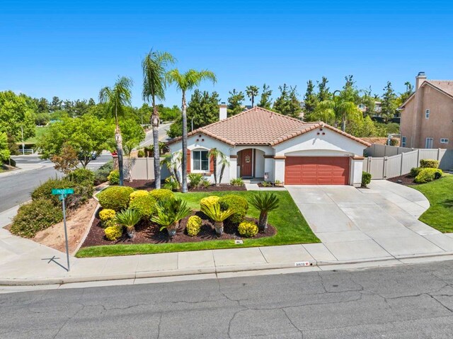 31920 Pasos Pl, Temecula, CA 92591 - mediterranean / spanish house featuring a tiled roof, a garage, concrete driveway, and stucco siding