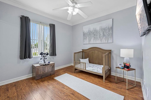 31920 Pasos Pl, Temecula, CA 92591 - bedroom featuring crown molding, wood finished floors, a nursery area, and a ceiling fan